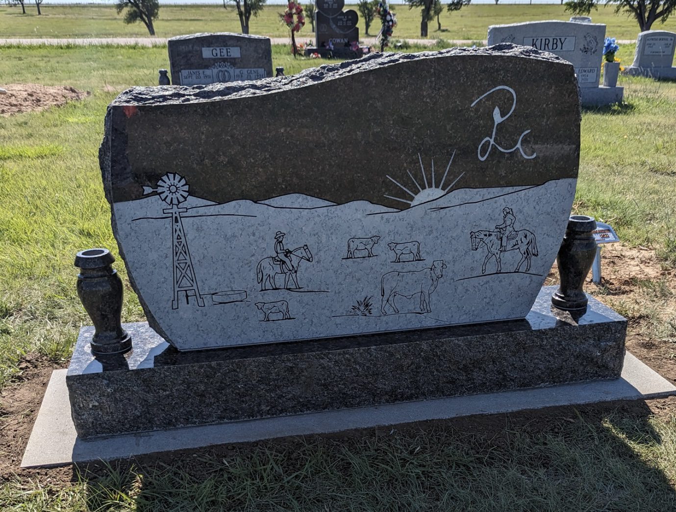 Rural-themed tombstone with windmill design