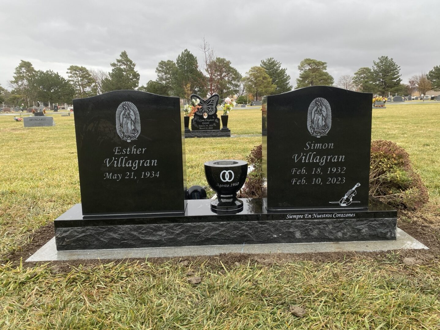 Black granite headstones in cemetery