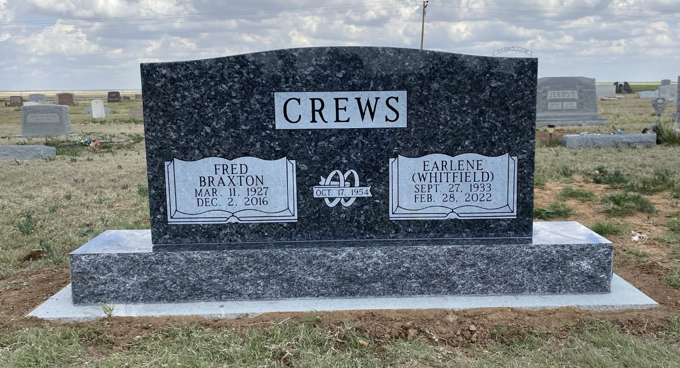 Black granite headstone in cemetery