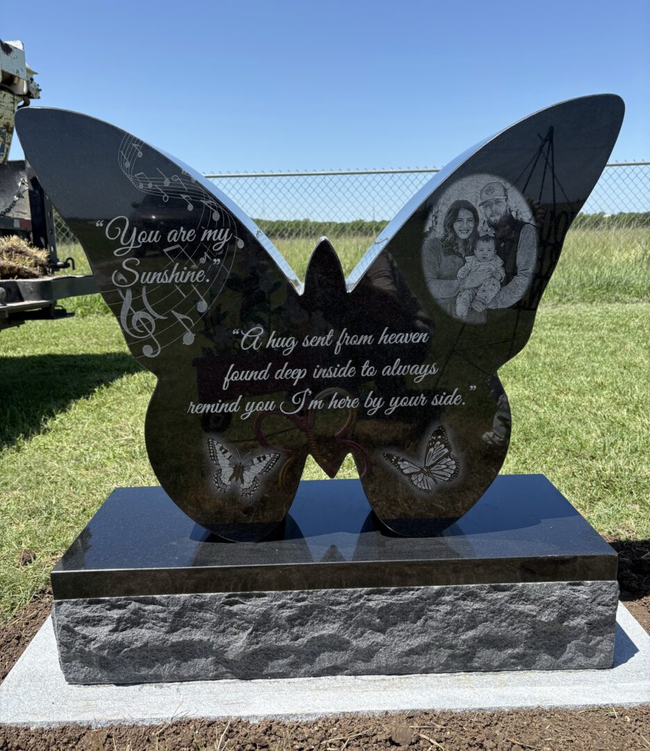 Engraved butterfly gravestone with message