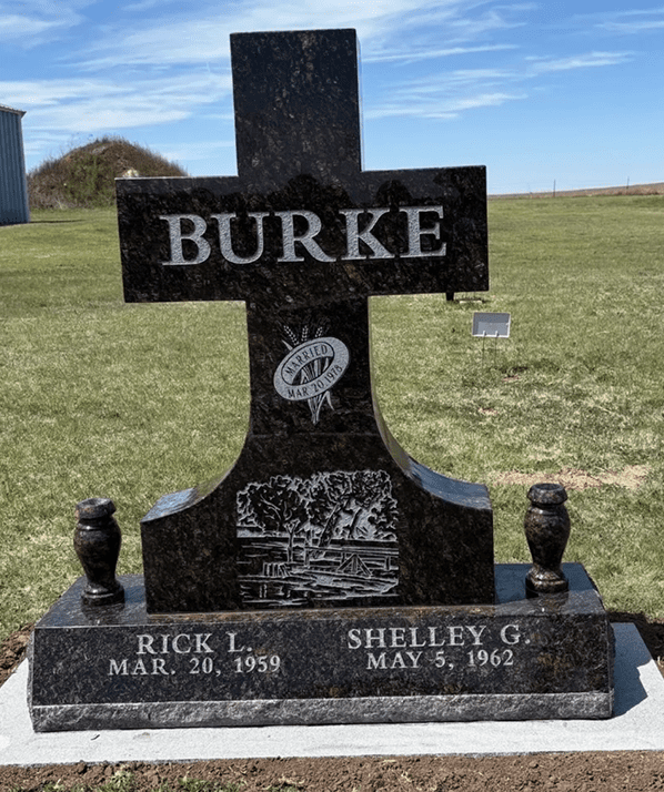 Black granite cross-shaped headstone